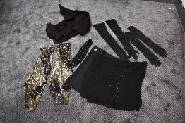 A mixed vintage lot containing scarves,sequinned sleeves,gloves and an antique lace shawl,