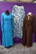 Three wonderfully floaty 1960s maxi dresses including Peterson Maid dress in a bright teal blue with