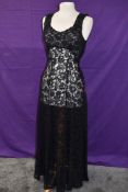 A black full length lace 1930s evening gown having half belt to back and full panelled skirt.