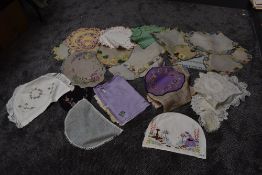 A selection of vintage tea cosy's, tray cloths and napkins, a lot having extensive embroidery.