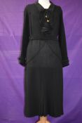 A vintage 1930s wool crepe day dress having amazing art deco stitched detailing throughout, with