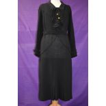 A vintage 1930s wool crepe day dress having amazing art deco stitched detailing throughout, with