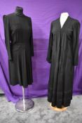 A 1940s black crepe day dress and a 1930s unlined garment.
