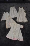 A collection of early 20th century babies clothing.