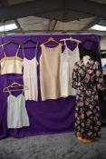 A collection of vintage lingerie and nightwear including 1940s housecoat,five slips/petticoats