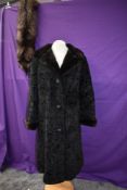 A ladies faux fur vintage coat and fox fur stole with head and feet.