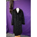 A ladies faux fur vintage coat and fox fur stole with head and feet.