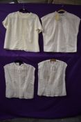 Four 1950s to early 60s blouses,two identical white blouses with pin tucks,thought to be unworn,