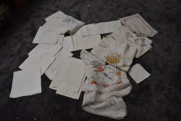 A collection of vintage and antique table linen, tray cloths , table cloths and napkins, a lot