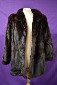 A mid length vintage dark brown mink coat having Continental furs,Blackpool label.