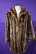 A vintage brown fur coat with pockets to front,fully lined,medium size approx.