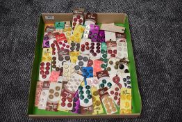 A large collection of vintage buttons on cards, around fifty pieces, various sizes,styles and