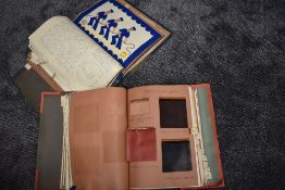 Two large vintage books containing a huge selection of fabric swatches, sewing technique examples