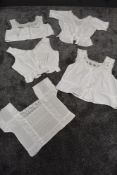 A collection of five antique corset covers/bodices, intricate detailing, lace and crotchet details