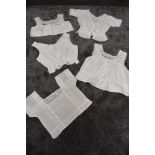 A collection of five antique corset covers/bodices, intricate detailing, lace and crotchet details
