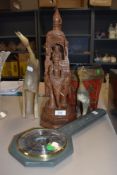 A selection of world themed items including Indonesian hand carved elephant figure
