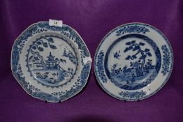 Two antique Chinese export hard paste soup or similar dishes being hand painted with traditional