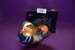 A Royal Crown Derby Paperweight Mandarin Duck, boxed and with Silver stopper