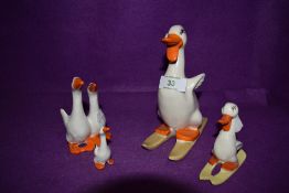 A selection of ceramic duck or goose figures by Beswick and Burslem