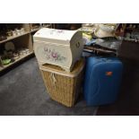 A selection of storage containers including painted bedding box and wicker laundry