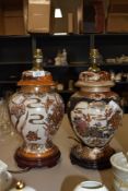 A pair of modern Chinese styled ginger jar lamps with naturalistic floral grounds