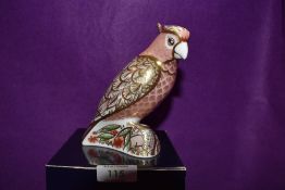 A Royal Crown Derby Paperweight Cockatoo, boxed and with Gold stopper