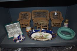 A selection of ceramics and miniature wicker furniture