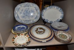 A mixed collection of vintage and antique plates and platters in various styles including Royal