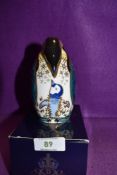 A Royal Crown Derby Paperweight Penguin and Chick, boxed and with Gold stopper