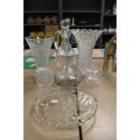 A selection of clear cut crystal glass wares including two vase and decanters