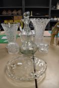 A selection of clear cut crystal glass wares including two vase and decanters