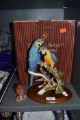 A Country Artist figure base of Sapphire and Gold parrot birds and similar