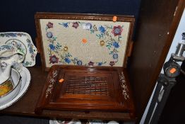 An Arts and Crafts serving tray having oak frame with floral cruel work