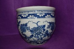 A traditional antique blue and white wear Chinese export hard paste fish bowl depicting well