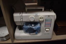 A New Home Model JD1722 sewing machine with multi function,including pedal.