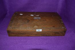 An antique lap desk having mother of pearl inlay to lid and brown velvet lining with compartmental