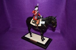 A limited edition figure by Coalport Trooping the colour no 171 of 450