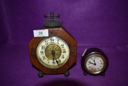 Two unusual mantle clocks having hexagon styled case and similar circular example
