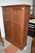 A Victorian pitch pine cupboard having shelved interior, some signs of historical worm, dimensions