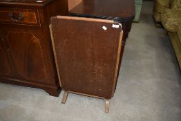 An early 20th Century folding firescreen/occasional table (af)