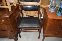 A vintage armchair having vinyl seat