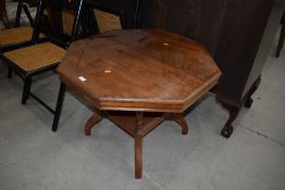 A late Victorian light mahogany or satinwood hexagonal table with under shelf in good condition