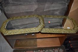 A pair of brass frame canted wall mirrors, width approx. 74cm