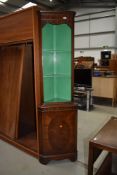 A reproduction Regency style mahogany corner display with open shelves over cupboard, height approx.