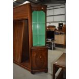 A reproduction Regency style mahogany corner display with open shelves over cupboard, height approx.