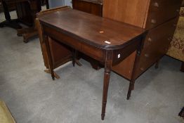 A Victorian mahogany fold over tea table on turned legs, approx width 89cm