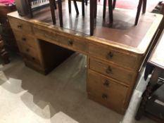 an early 20th century library or office desk having compartmented drawers oak carcass and