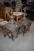 A pair of traditional copper street lamp tops