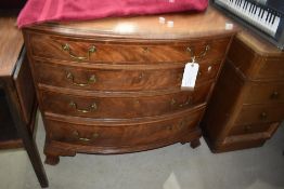 A 19th Century mahogany chest of four long bow fronted drawers having brass drop handles and bracket