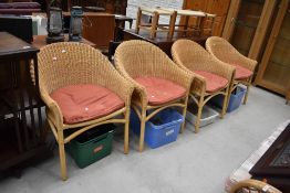 A set of four modern canework tub chairs